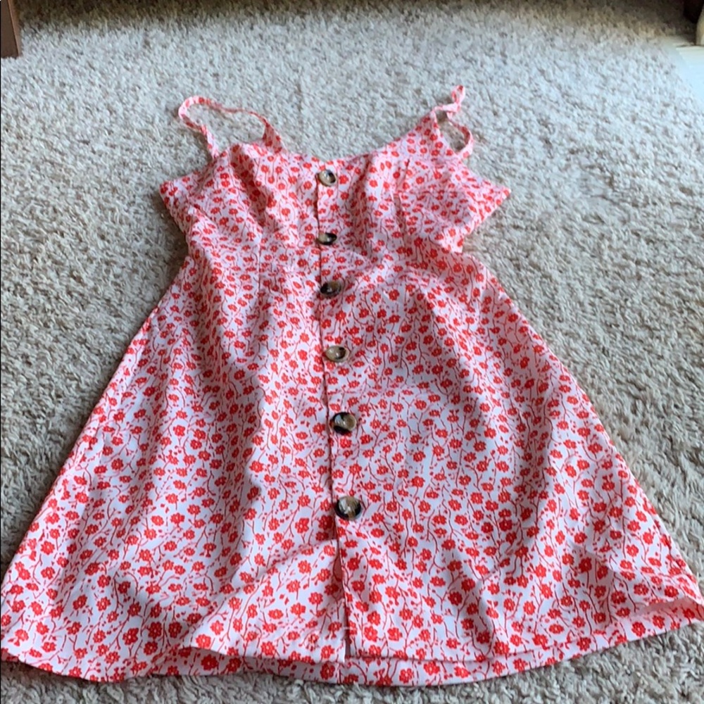 Summer dress. Red flowers on white background